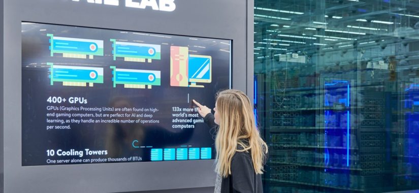 A lady looks at the technical specifications of the IRL system. Image via Walmart