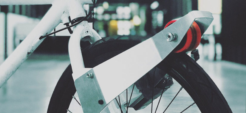 The CLIP e-motor latches itself onto the tire to allow automated-assist cycling mode.