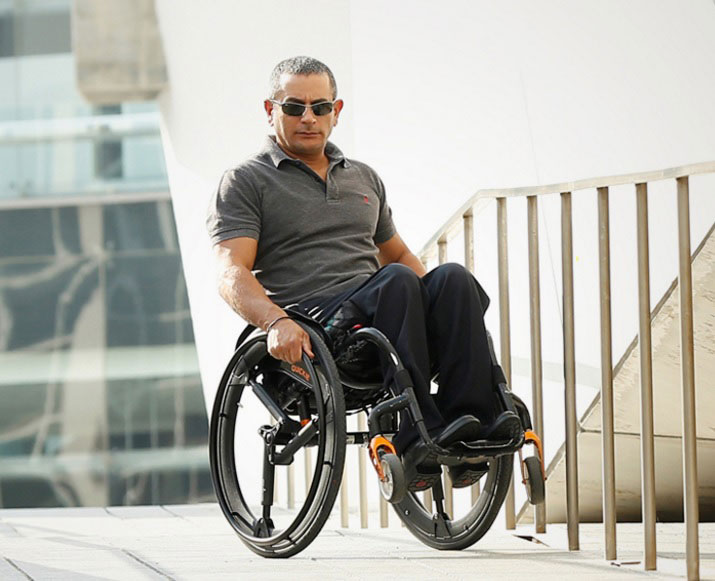 Gilad Wolf, the product designer tests out the Softwheel on his wheelchair. Image via NoCamel