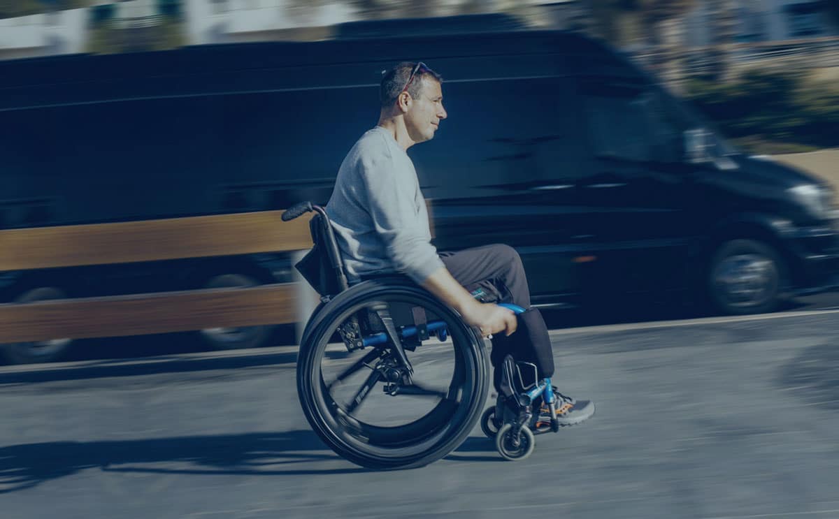 A wheelchair user travels uphill on Softwheel. Image via Softwheel Technology