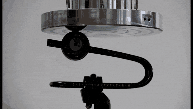The image shows the spring prototype being tested while withstanding the weigh of the steel on top of it. Image via Rinsten